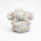 Back view of handmade crochet elephant plush in speckled white yarn.